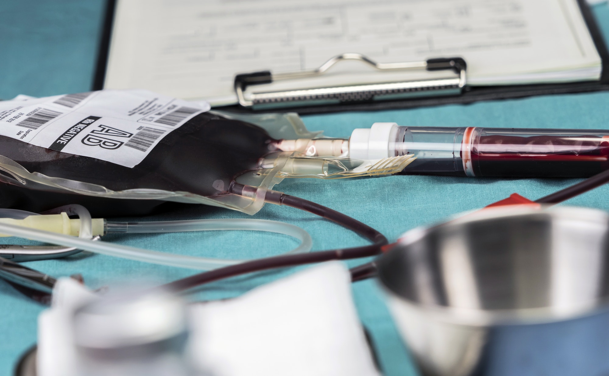 Empty blood Bag next to dropper, conceptual image